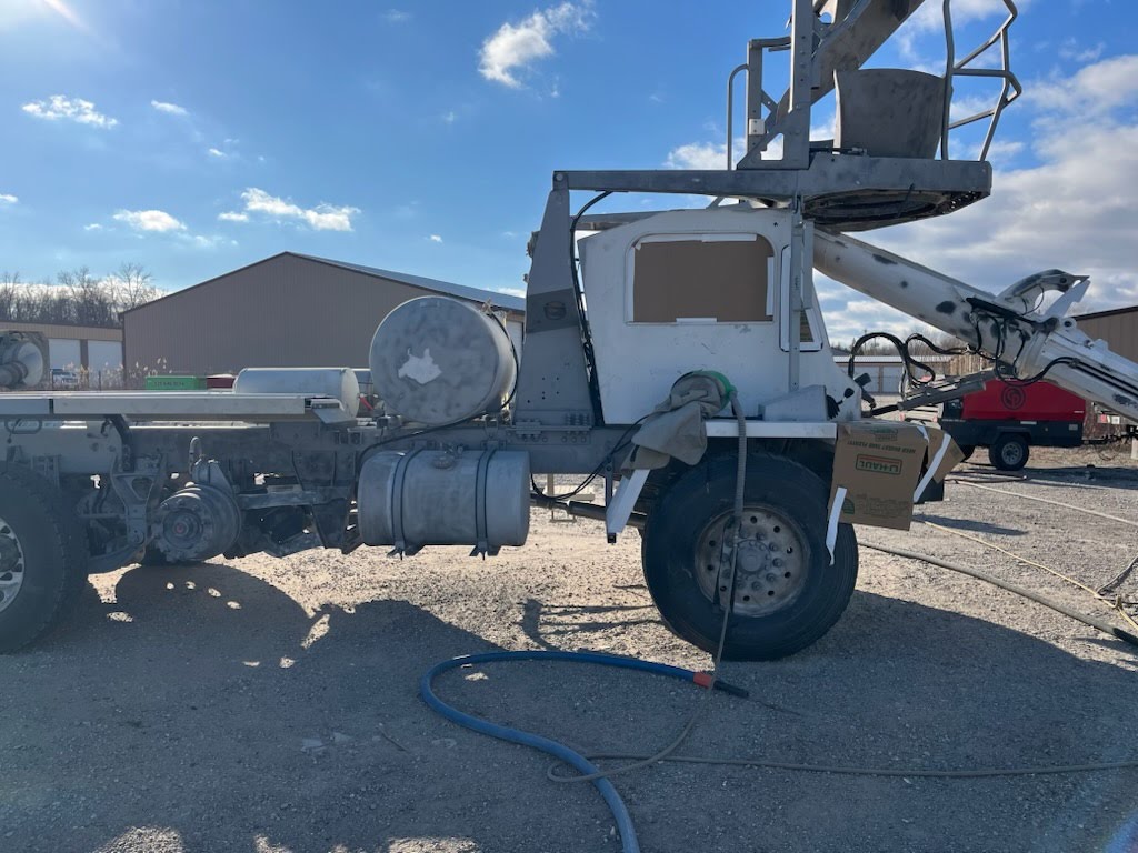 Concrete truck being sandblasted by ProBlast dustless blasting